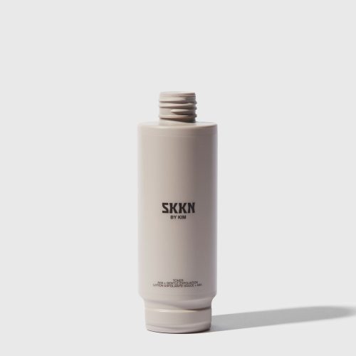 Opened bottle of SKKN BY KIM Toner Pore Reducing next to cap | Refill